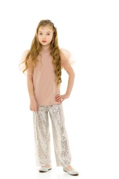 Cute little girl in trousers. The concept of style and fashion. Isolated on a white background.