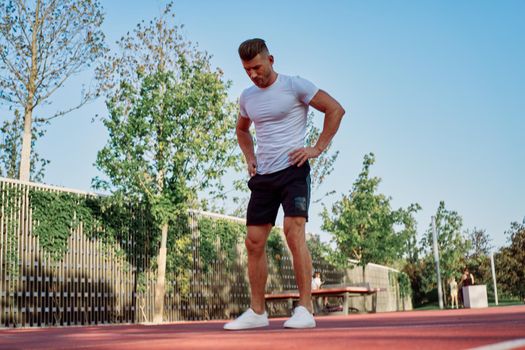 man doing exercises outdoors on the playground. High quality photo