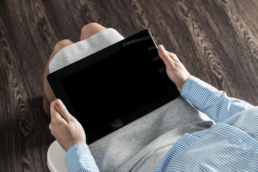 close-up of female hands with a computer tablet