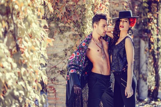 Portrait of beautiful couple, models of fashion, wearing spanish clothes