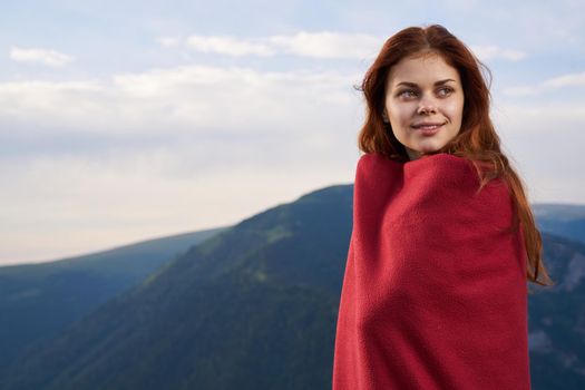 woman with red plaid on nature in the mountains vacation adventure. High quality photo