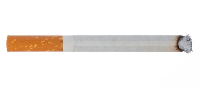 Lit cigarette isolated on white background close up top view