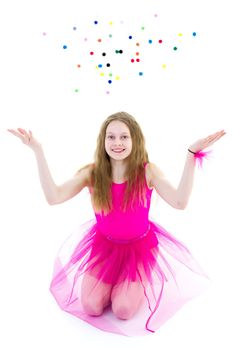 A beautiful girl gymnast school age throws multicolored confetti. The concept of sports, recreation. Isolated on white background