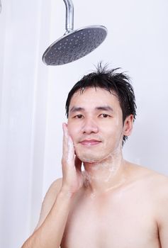 man washing face in the bathroom at home