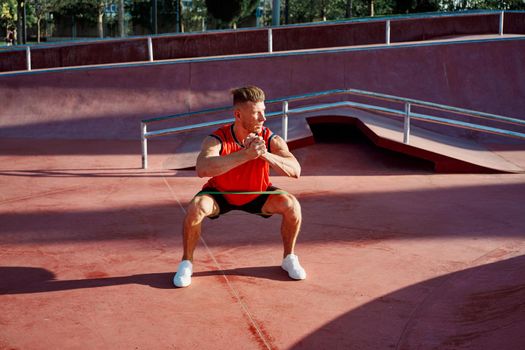 athletic man in red jersey workout exercise pumped up body. High quality photo