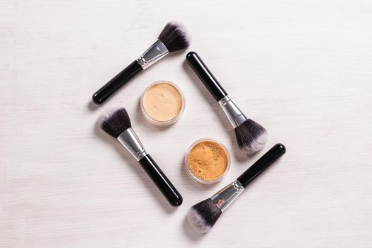 Mineral face powder and brush. Eco-friendly and organic beauty products.