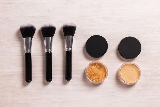 Mineral face powder and brush. Eco-friendly and organic beauty products.