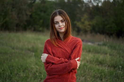 woman red sweater cool air nature romance. High quality photo