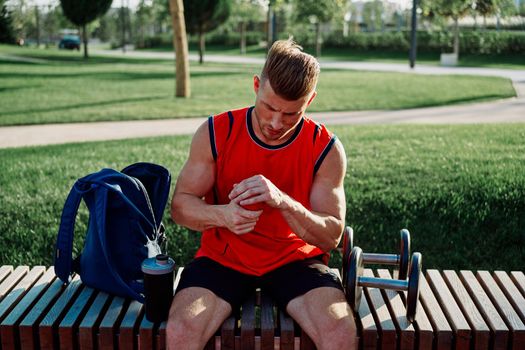 sporty man in the park workout exercise fitness motivation. High quality photo