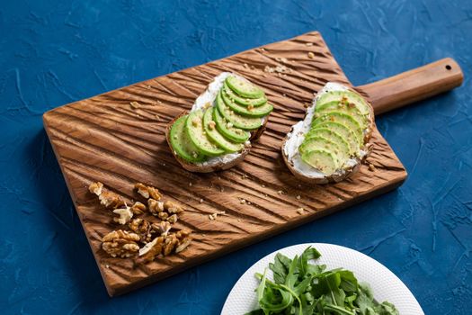 sliced avocado on toast bread with spices.