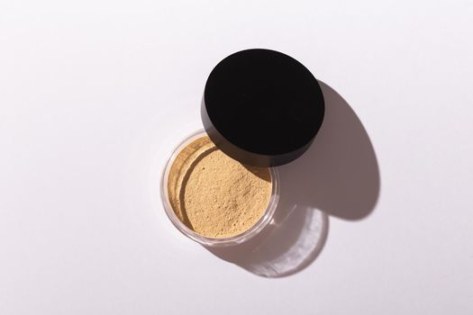 Mineral powder foundation isolated on a white background. Eco-friendly and organic beauty products.