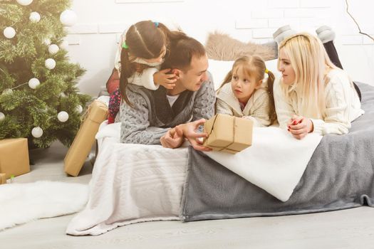 Portrait of friendly family on Christmas evening