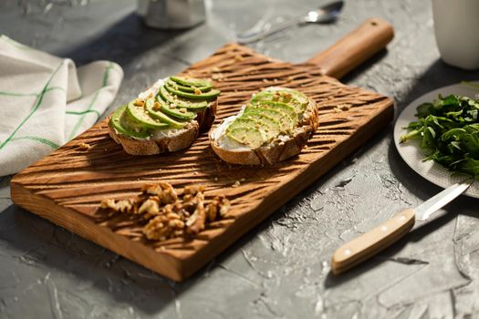 sliced avocado on toast bread with spices.