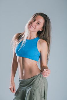 Portrait of young slim fitness woman. Sport and healthy lifestyle concept