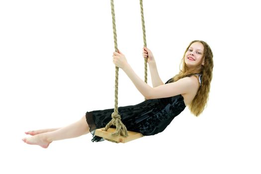 School-age teenage girl swinging on a swing. The concept of rest after class. Isolated on white background.