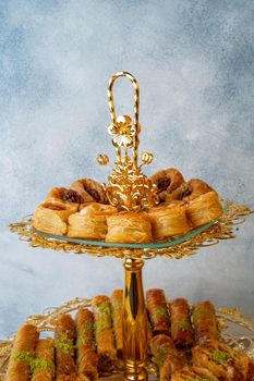 Variety of Turkish desserts served on cake stand, close up