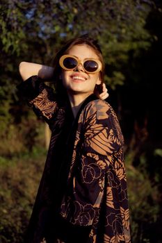 woman wearing sunglasses outdoors posing fashion. High quality photo