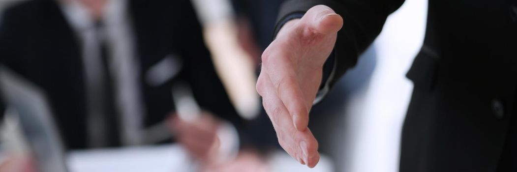 Businesswoman offer hand to shake as hello in office closeup. Serious business, friendly support service, excellent prospect, introduction or thanks gesture, gratitude, invite to participate concept