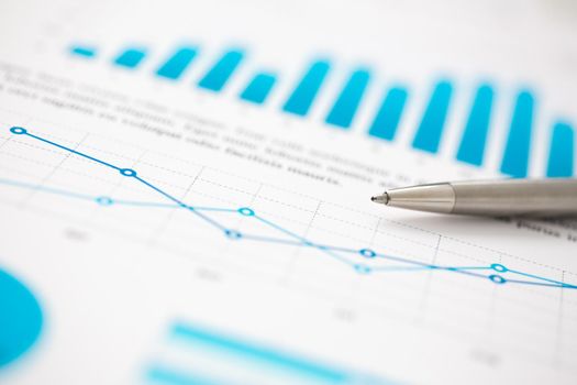 Financial statistics documents ball pen infographics at office table closeup. Internal Revenue Service inspector sum check, investigation, exchange market, earnings, savings, loan and credit concept