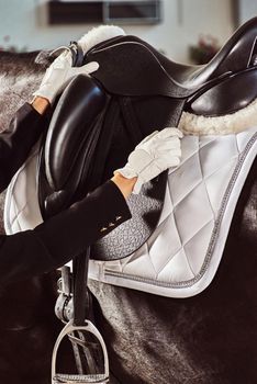 woman jockey with his horse in uniform for Dressage