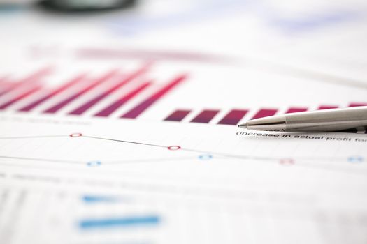 Financial statistics documents ball pen infographics at office table closeup. Internal Revenue Service inspector sum check, investigation, exchange market, earnings, savings, loan and credit concept