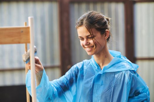 women paint wooden structures brush painter decoration. High quality photo