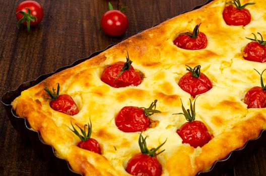 Homemade baking. Cherry tomato snack pie. Studio Photo