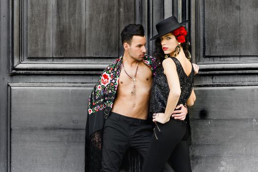 Portrait of beautiful couple, models of fashion, wearing spanish clothes