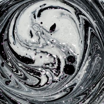 abstract image mixing of two colors. The texture of the circles of white and black paint - image