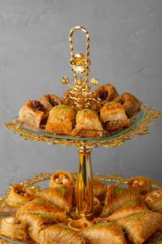 Variety of Turkish desserts served on cake stand, close up