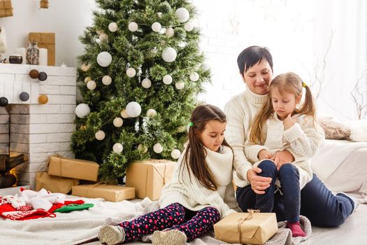 mother and children at home for christmas.