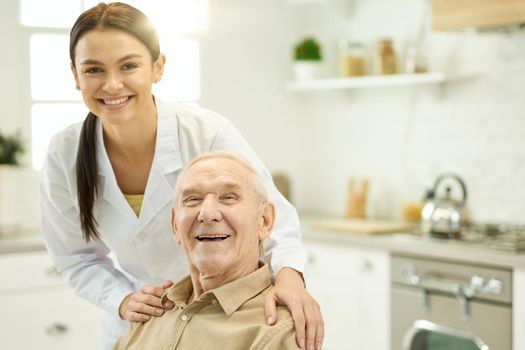 Copy-space photo happy senior man smiling while having professional trusted doctor by his side