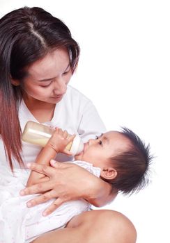 Mother feeding baby daughter isolated on a white background