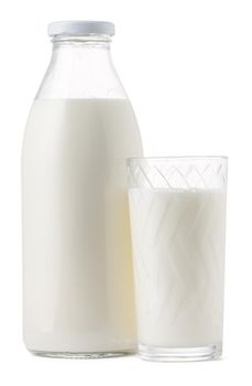 Glass bottle and cup of fresh milk isolated on white