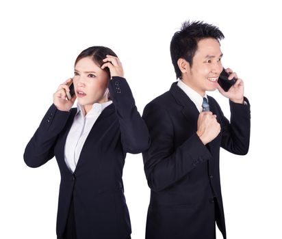 worried businesswoman and happy businessman talking on smartphone isolated on white background
