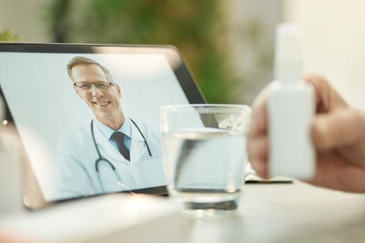 Selective focus of tablet set to a video-call with a medical worker for remote consultations