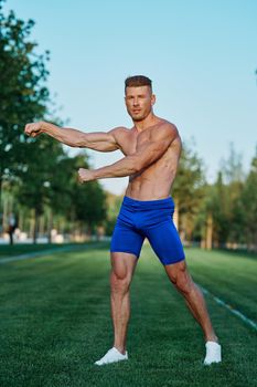 man doing exercises in the park inflated body. High quality photo