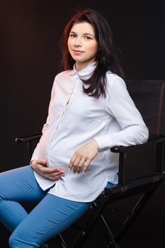 Pregnant female waiting of baby. Concept of maternity, parenting, prepare and expect. Happy mother during pregnancy. High quality photo