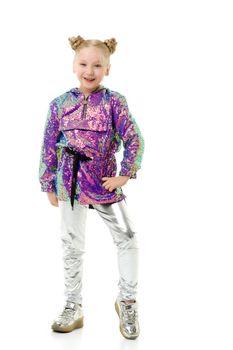 Cute little girl in trousers. The concept of style and fashion. Isolated on a white background.