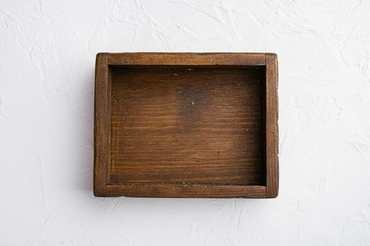 Empty wooden box set with copy space for text or food, top view flat lay, on white stone table background