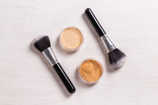 Mineral face powder and brush. Eco-friendly and organic beauty products.