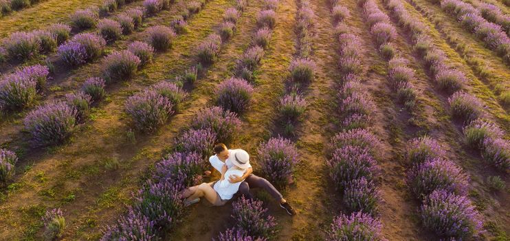 Young couple playing around in the lavender fields.