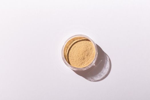 Mineral powder foundation isolated on a white background. Eco-friendly and organic beauty products.