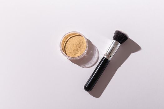 Mineral face powder and brush. Eco-friendly and organic beauty products.