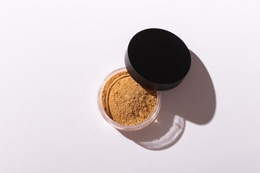 Mineral powder foundation isolated on a white background. Eco-friendly and organic beauty products.