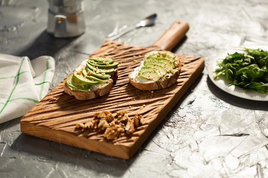 sliced avocado on toast bread with spices.