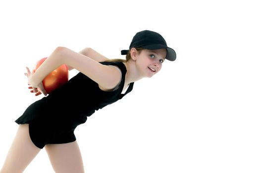 A charming little girl is engaged in fitness with a ball. The concept of gymnastics, health and sports. Isolated on white background.