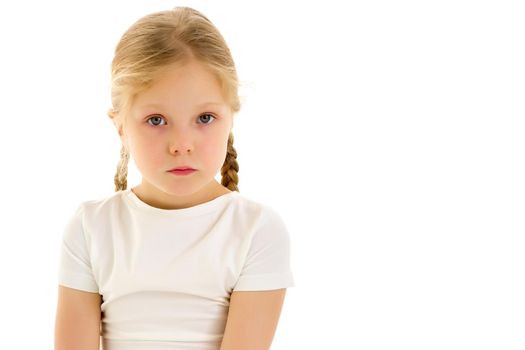 Close-up portrait of a little girl in a clean white t-shirt. You can put a logo or any other inscription on the shirt.