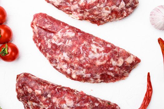 Homemade meat beef cutlets set, on white stone table background, top view flat lay