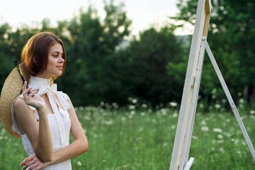 woman artist outdoors painting nature hobby art. High quality photo